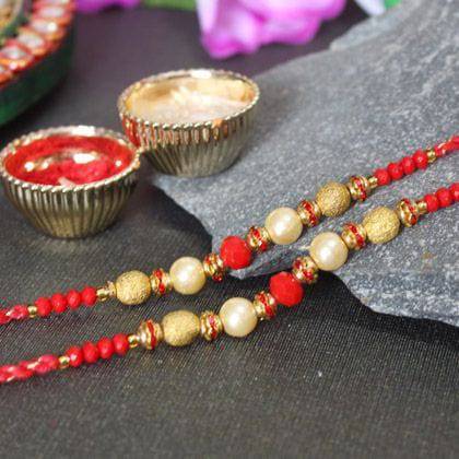 2 Golden and Red Beaded Designer Pearl Rakhis - YuvaFlowers
