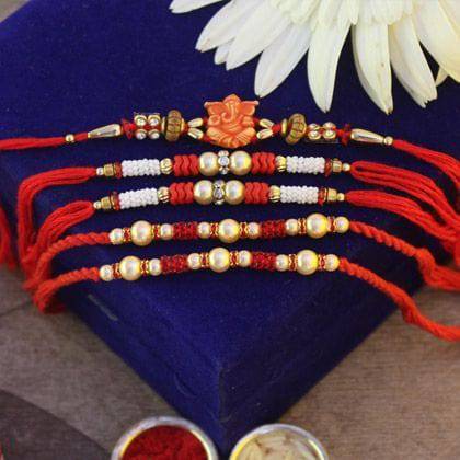 Beautifully Red Rakhi - YuvaFlowers