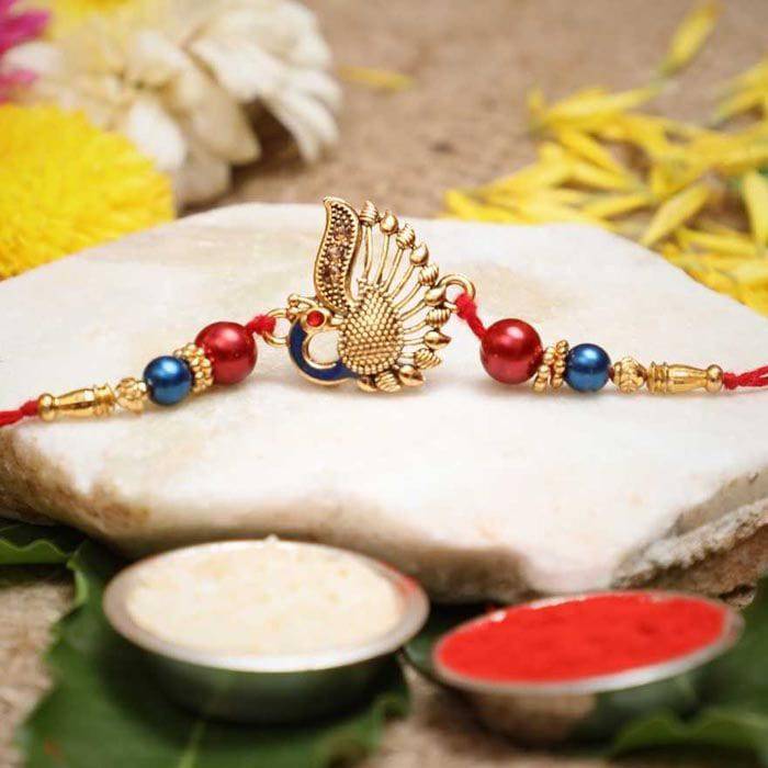 Designer Peocock Rakhi With Roli Pack - YuvaFlowers