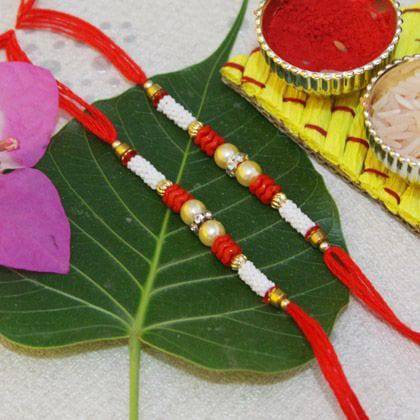 White and Red Beaded Rakhi - YuvaFlowers