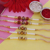 White & Golden Rakhis - YuvaFlowers