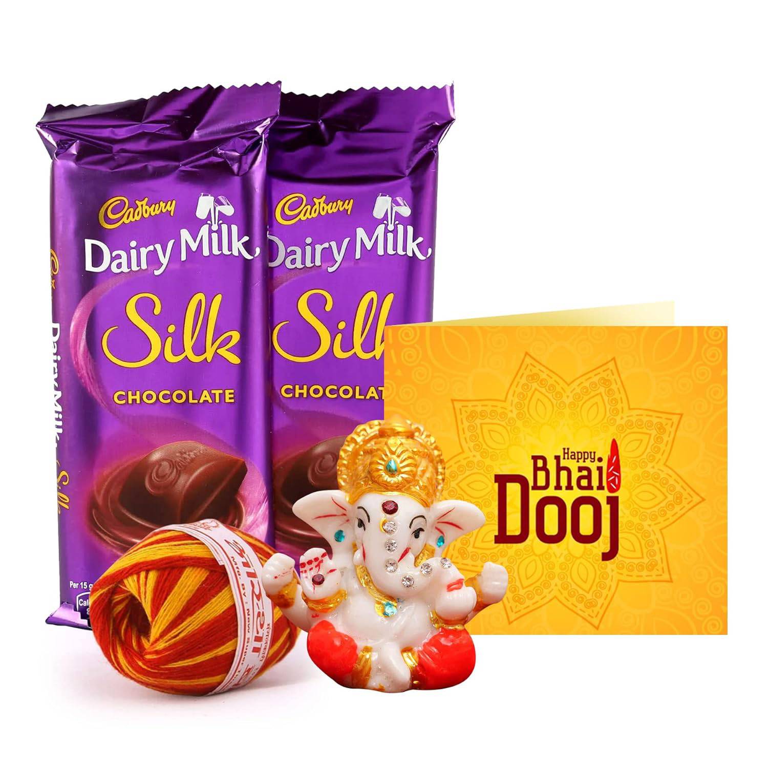 Bhai Dooj Gift Set for Brother with Dairy Milk Silk Chocolates Mini Ganesha Idol Statue Greeting Card and Kalawa Moli Roli Chawal Tika Hamper - YuvaFlowers