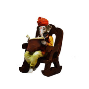 Lord Ganesha Reading Book on Wooden Chair (LxWxH - 4INx5INx6.5IN) - YuvaFlowers