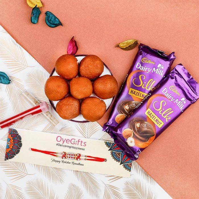 Rakhi Sacred Scrummy Surprise - YuvaFlowers