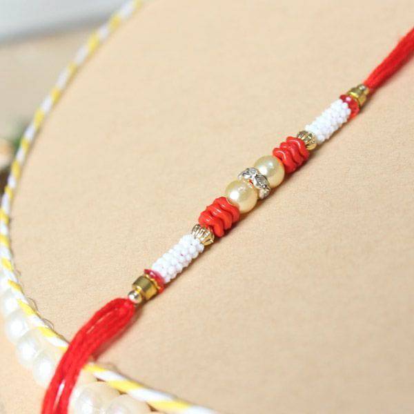 Red & White Beaded Designer Rakhi - YuvaFlowers